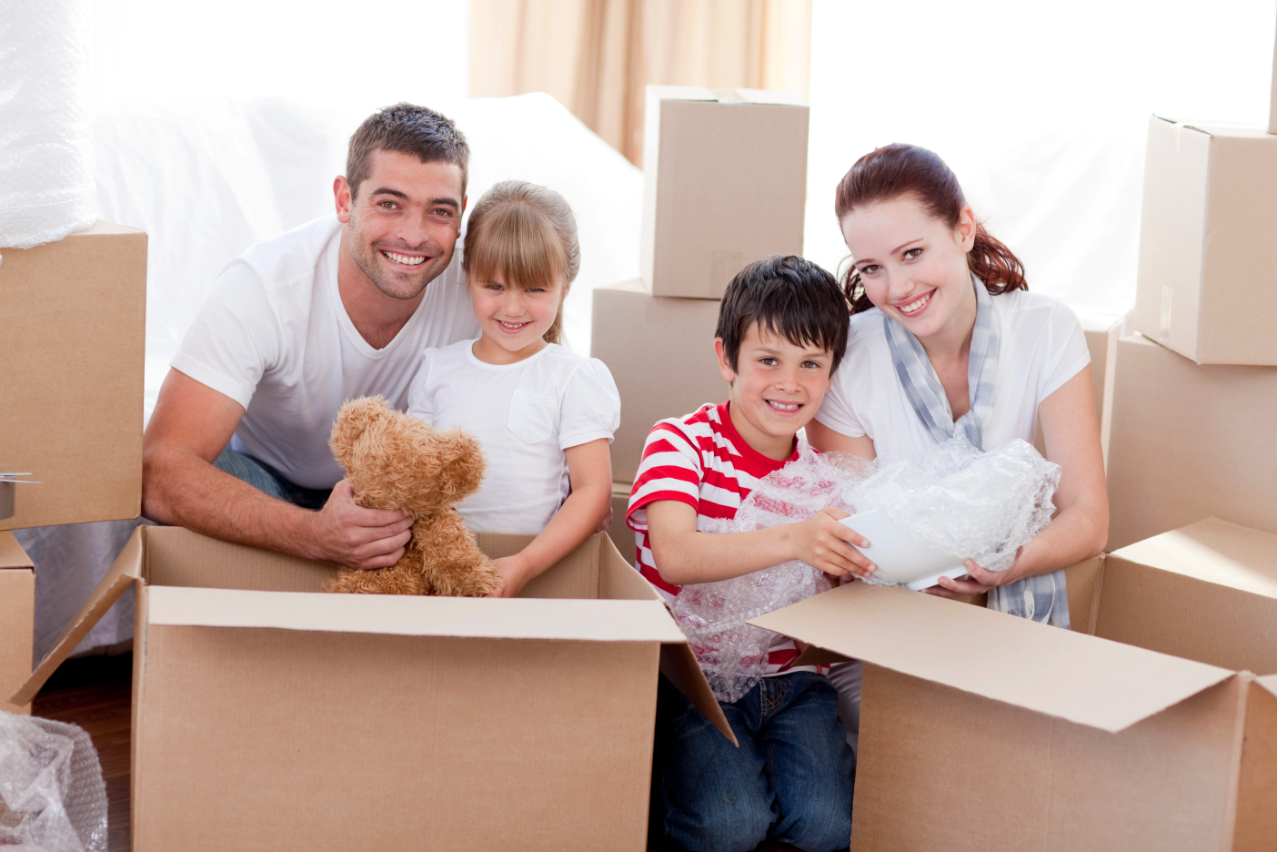 Family Moving Home with Boxes